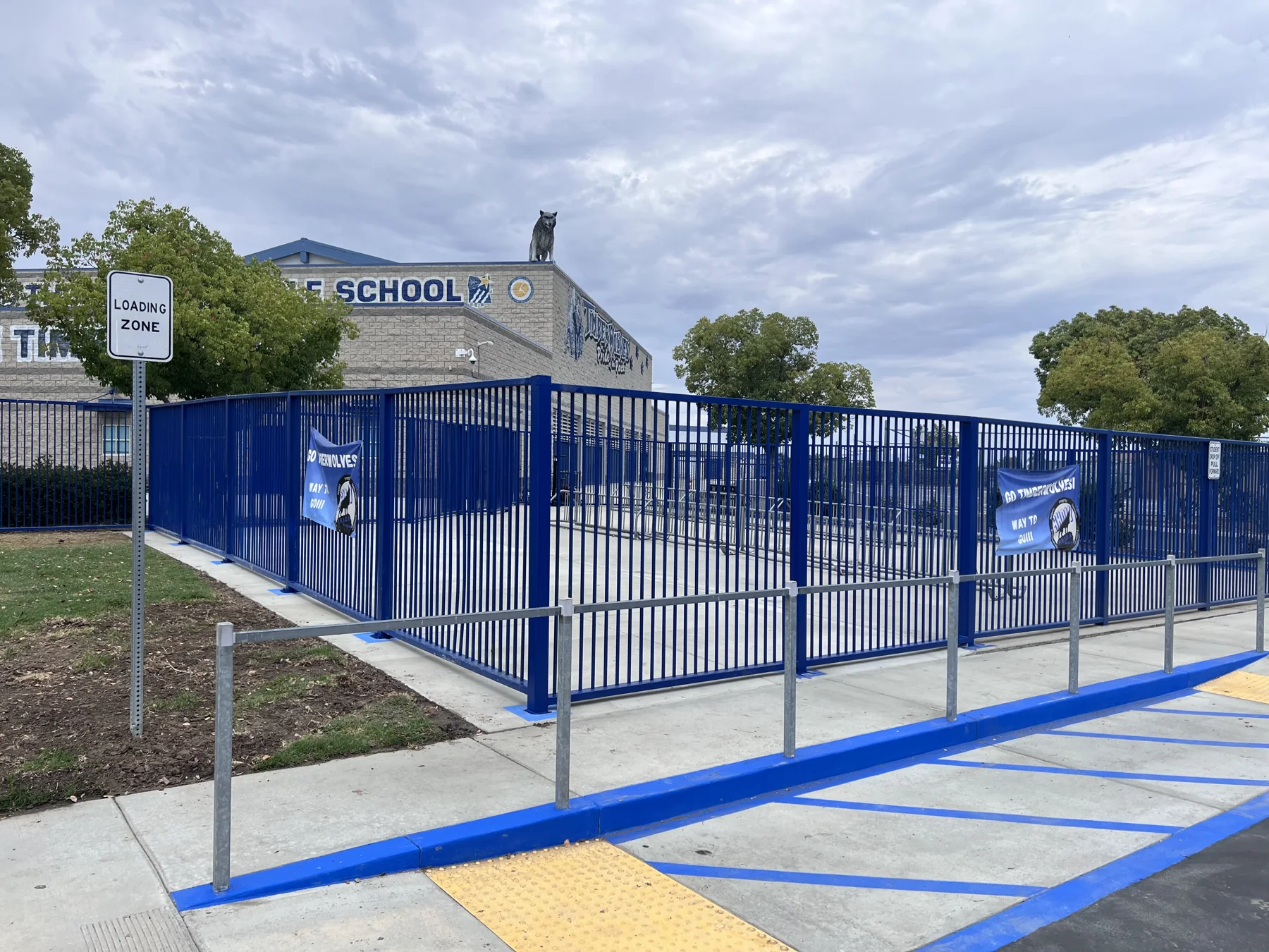 Blue metal perimeter fence and gates at a school site