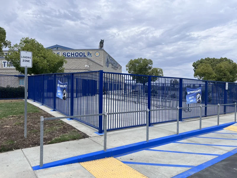 Blue metal perimeter fencing