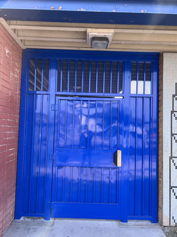 Security gate with solid metal infill